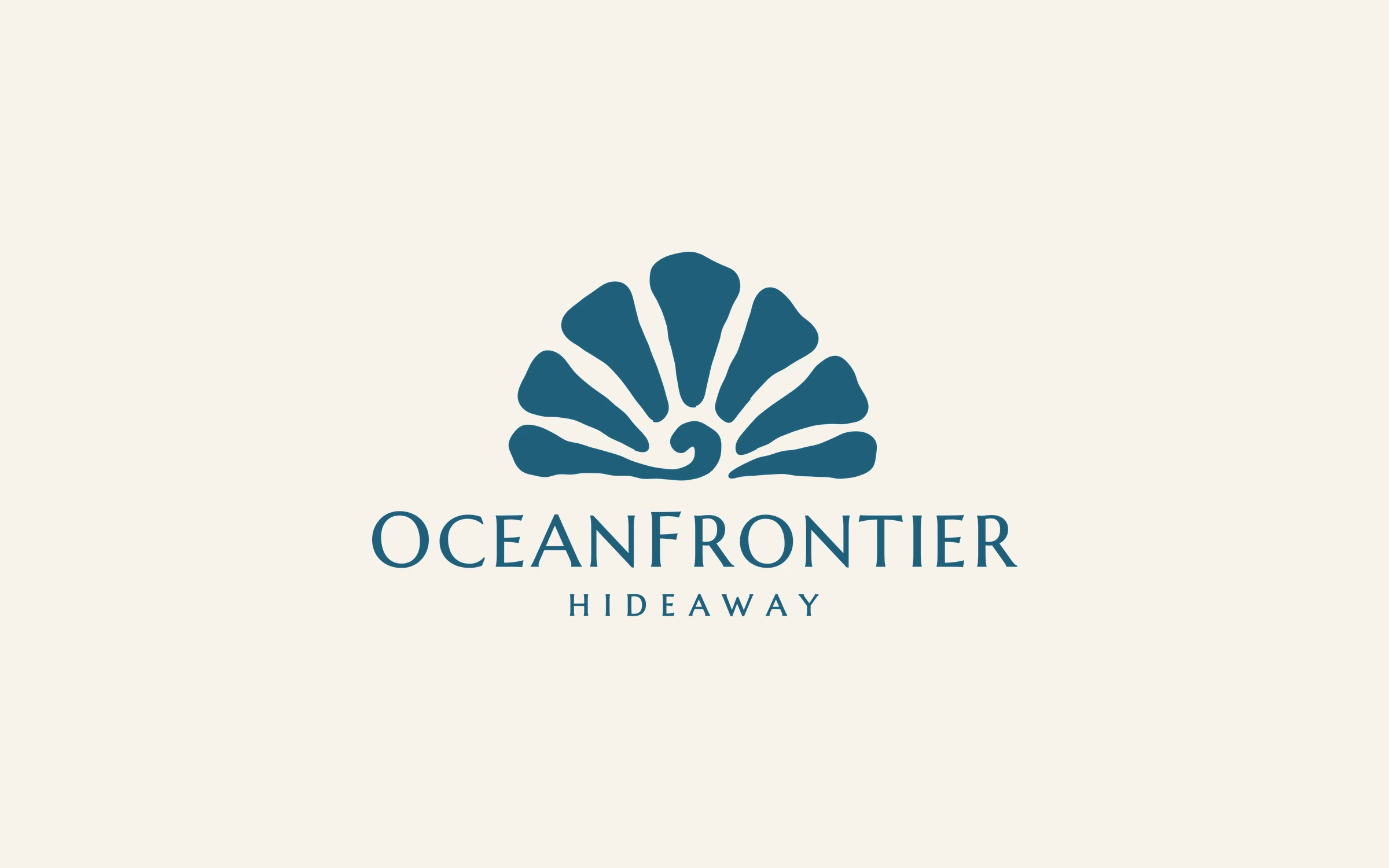 The Ocean Frontier Hideaway logo in deep teal on warm off-white: a fan-shaped shell with a small wave curl at its base, above the name in serif capitals.